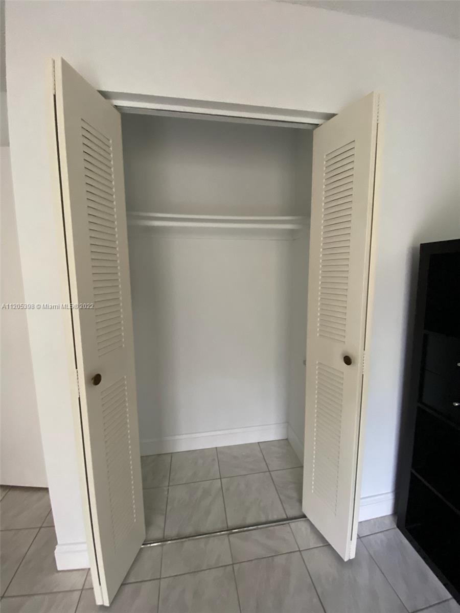 10478 Southwest 75th Lane Miami, FL 33173 - Photo 13 of 45 a view of an empty walk in closet