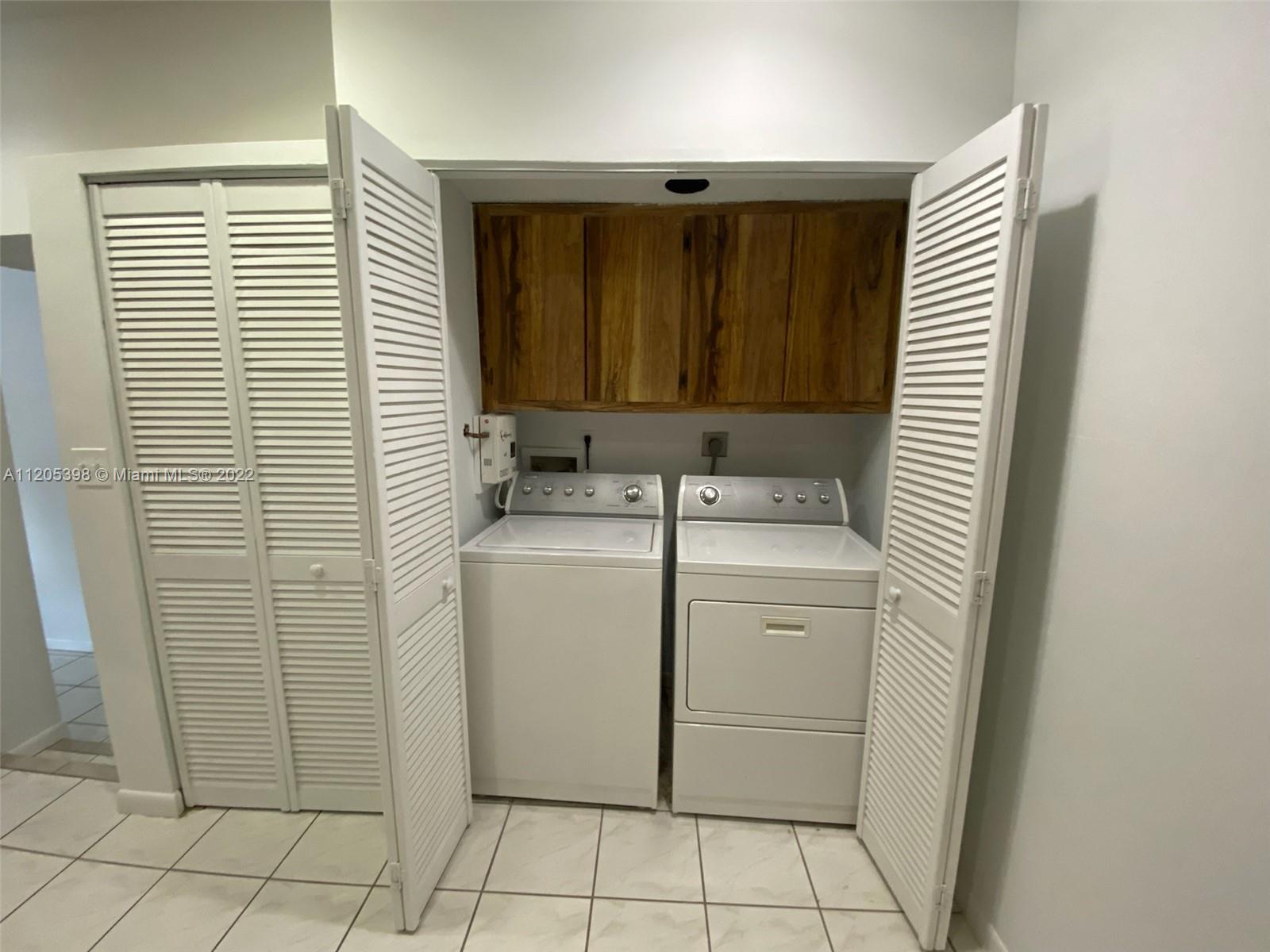 10478 Southwest 75th Lane Miami, FL 33173 - Photo 20 of 45 a utility room with a washer and dryer