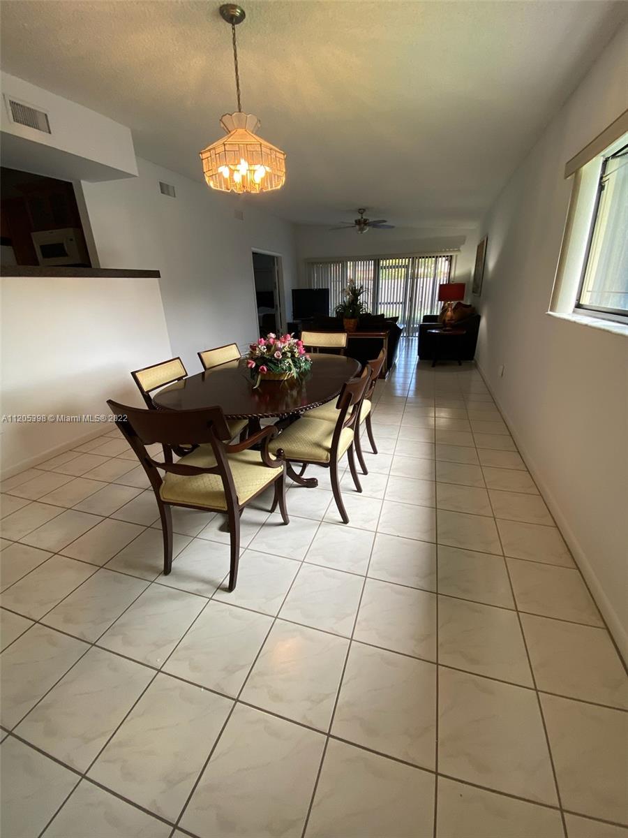 10478 Southwest 75th Lane Miami, FL 33173 - Photo 34 of 45 a view of a livingroom with furniture and window