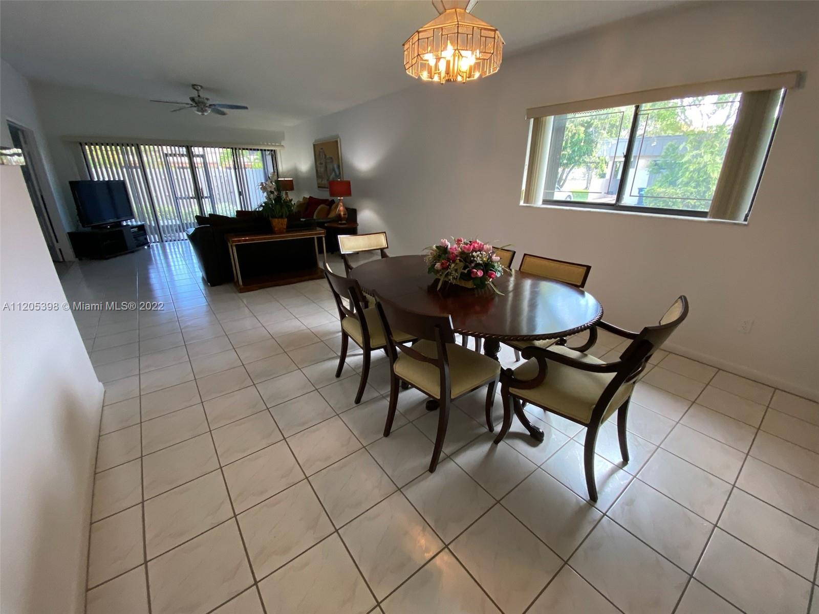 10478 Southwest 75th Lane Miami, FL 33173 - Photo 36 of 45 a view of a dining room with furniture