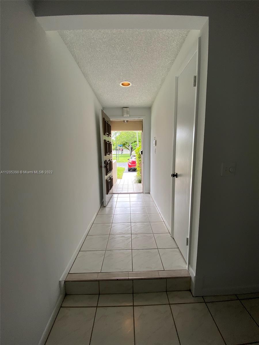 10478 Southwest 75th Lane Miami, FL 33173 - Photo 6 of 45 a view of entryway with hallway