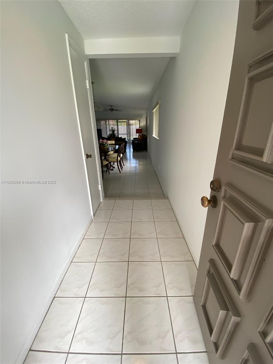 10478 Southwest 75th Lane Miami, FL 33173 - Photo 8 of 45 a view of an empty room with stairs