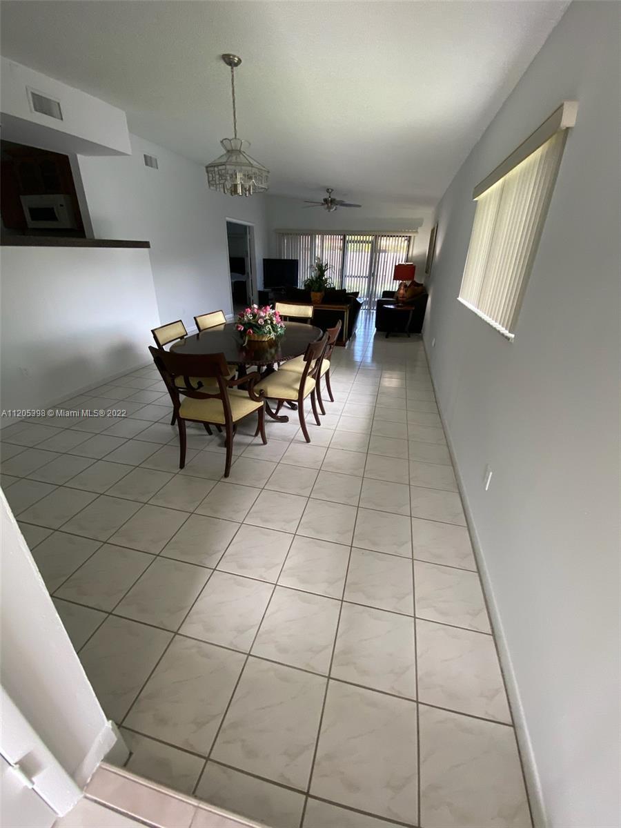 10478 Southwest 75th Lane Miami, FL 33173 - Photo 9 of 45 a view of a workspace with furniture