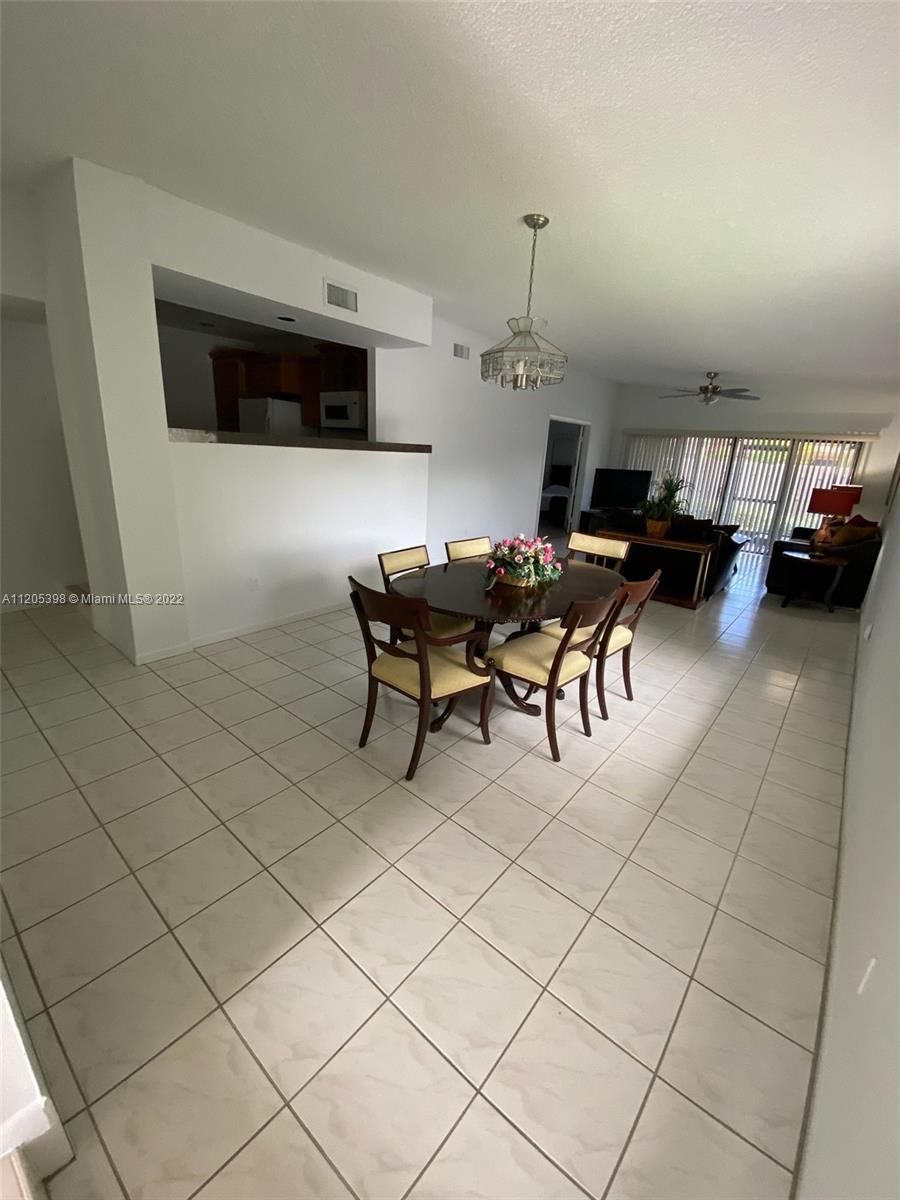 10478 Southwest 75th Lane Miami, FL 33173 - Photo 10 of 45 a outdoor space with furniture