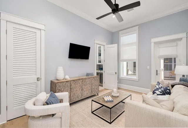 a front view of a house with a garden and plants