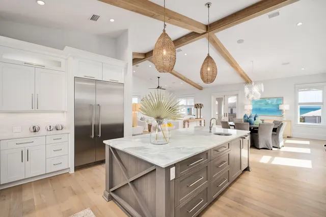 a front view of multiple houses with yard