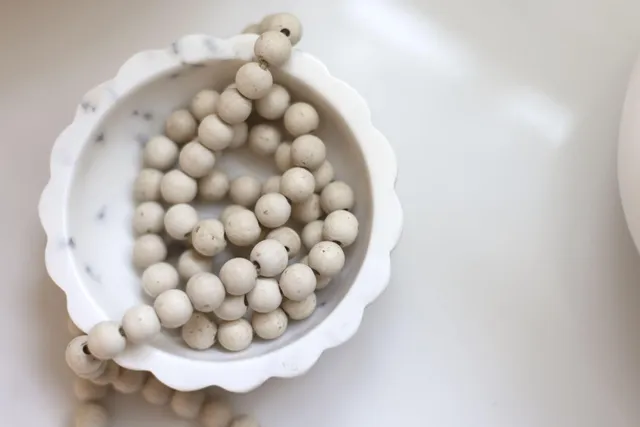 a bathroom with a sink double vanity granite tub shower and a mirror