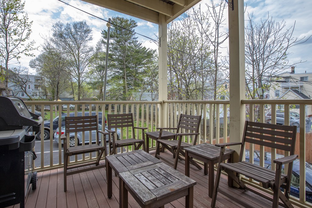 96 Dix Street, Unit 2 Boston, MA 02122 - Photo 11 of 11 a view of a balcony with wooden floor and outdoor seating
