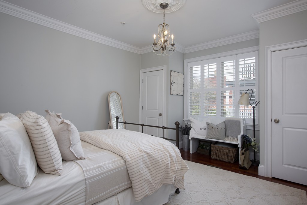 96 Dix Street, Unit 2 Boston, MA 02122 - Photo 8 of 11 a bedroom with bed and a window