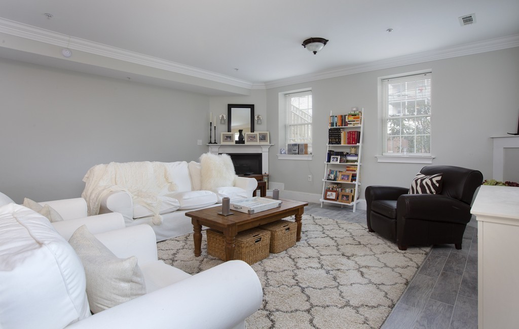 96 Dix Street, Unit 2 Boston, MA 02122 - Photo 9 of 11 a living room with furniture and a fireplace