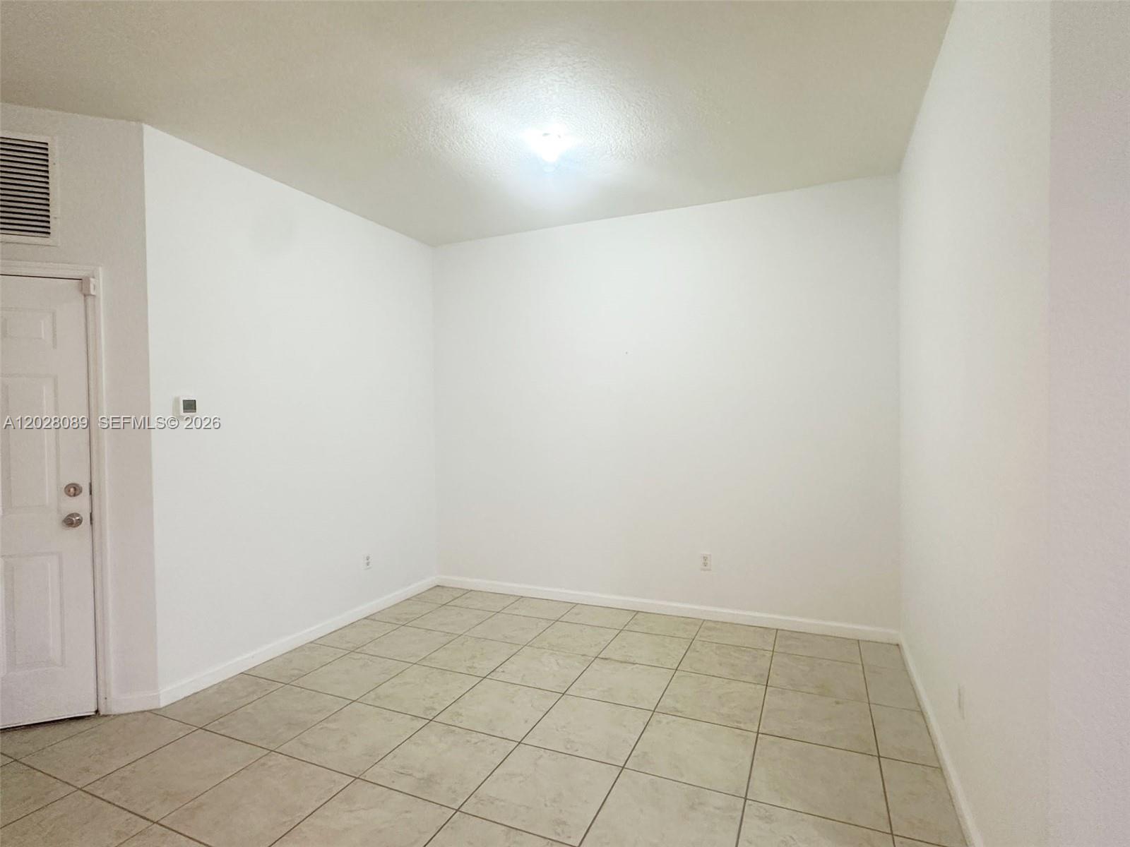 662 Northeast 21st Terrace Homestead, FL 33033 - Photo 8 of 34 a view of an empty room