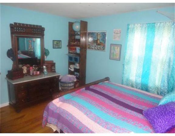 10 Canterbury Road Springfield, MA 01118 - Photo 11 of 15 a bedroom with a bed dresser and a window