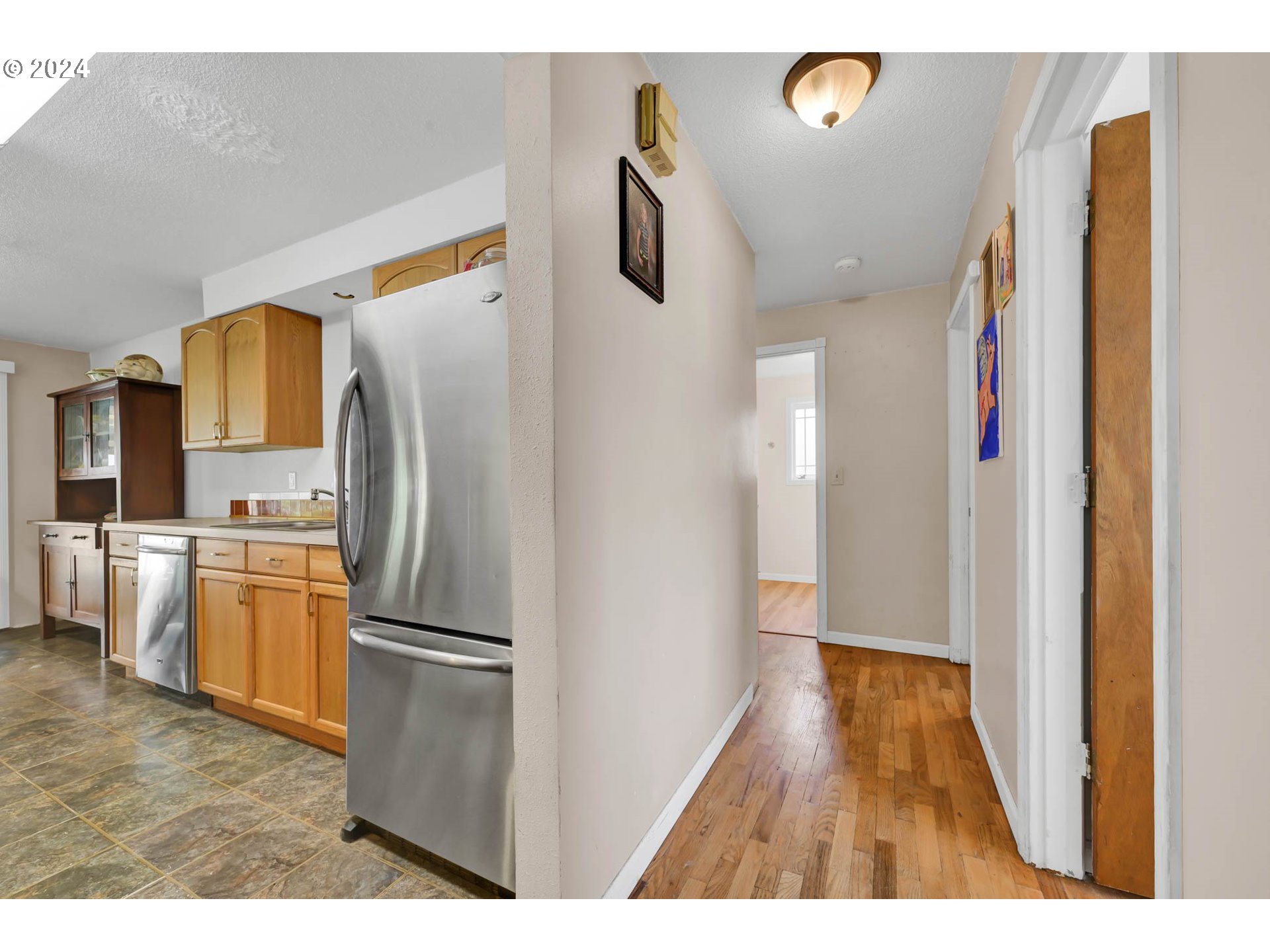 2301 Compton Street Eugene, OR 97404 - Photo 14 of 27 a kitchen with a refrigerator and a sink