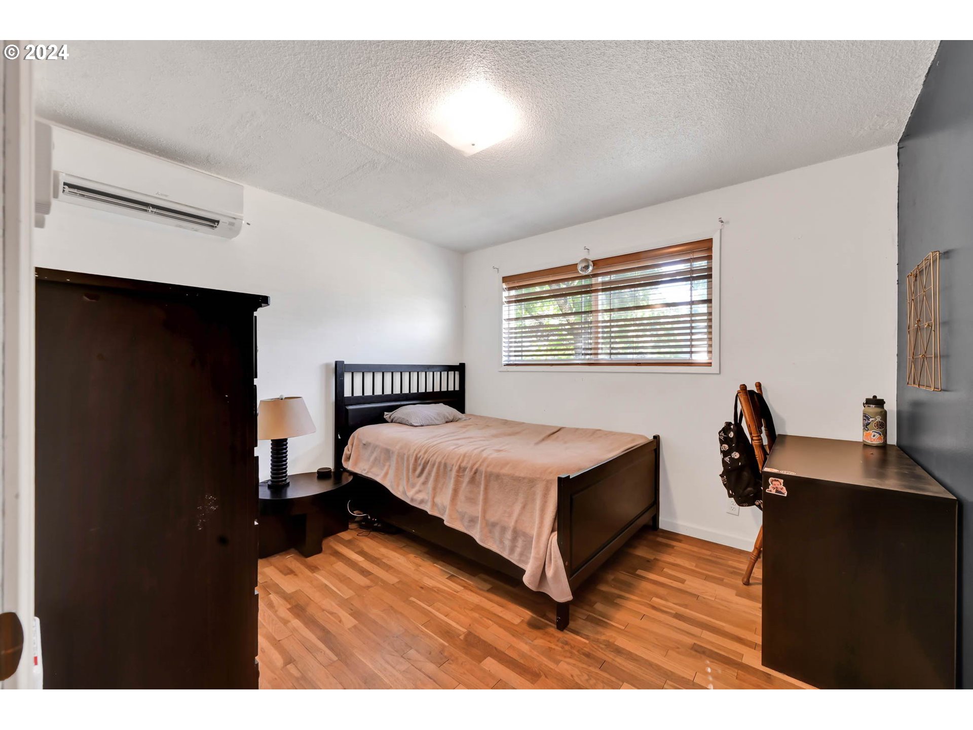 2301 Compton Street Eugene, OR 97404 - Photo 19 of 27 a bedroom with a bed and a desk