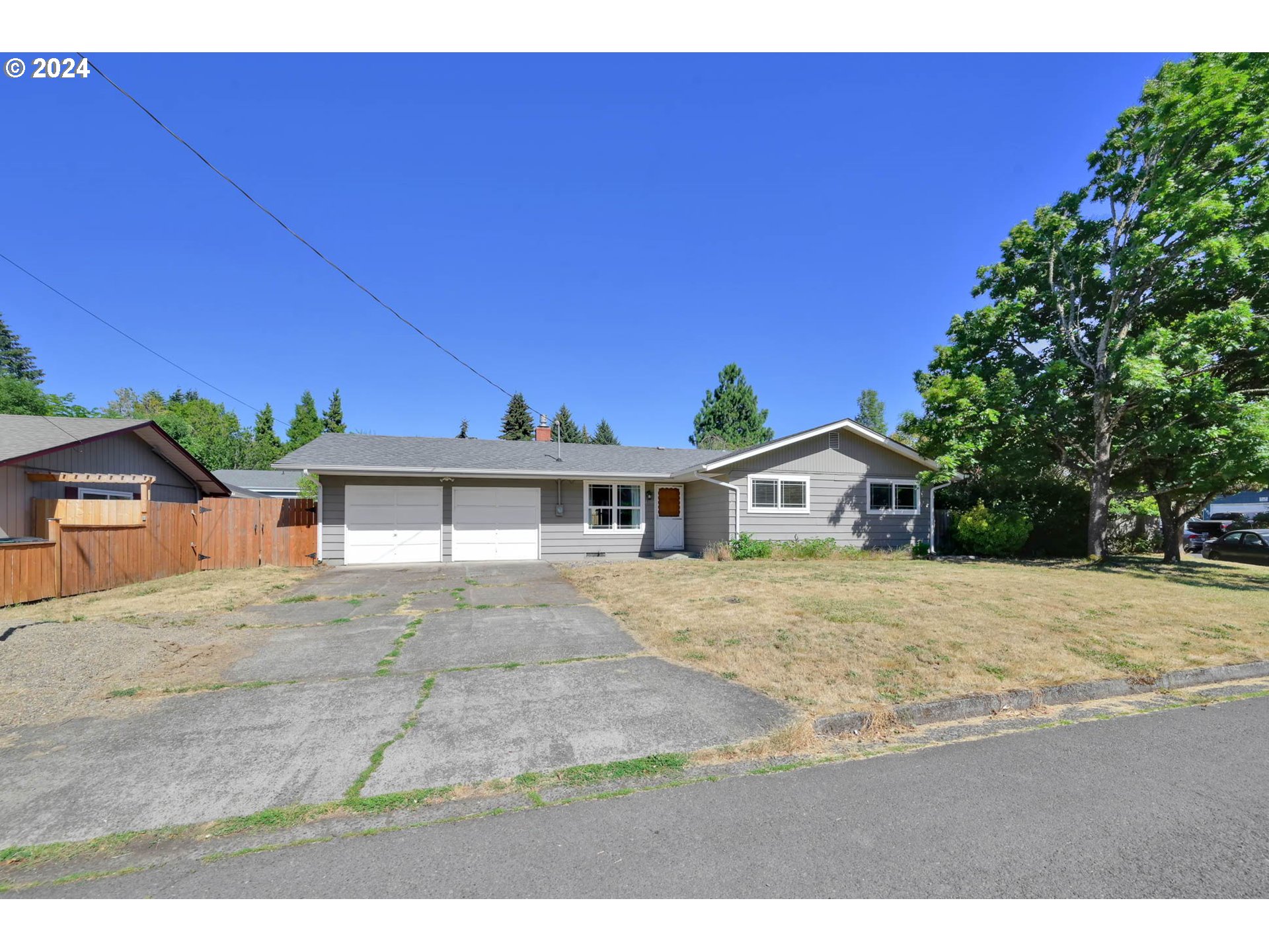 2301 Compton Street Eugene, OR 97404 - Photo 2 of 27 a front view of a house with a yard