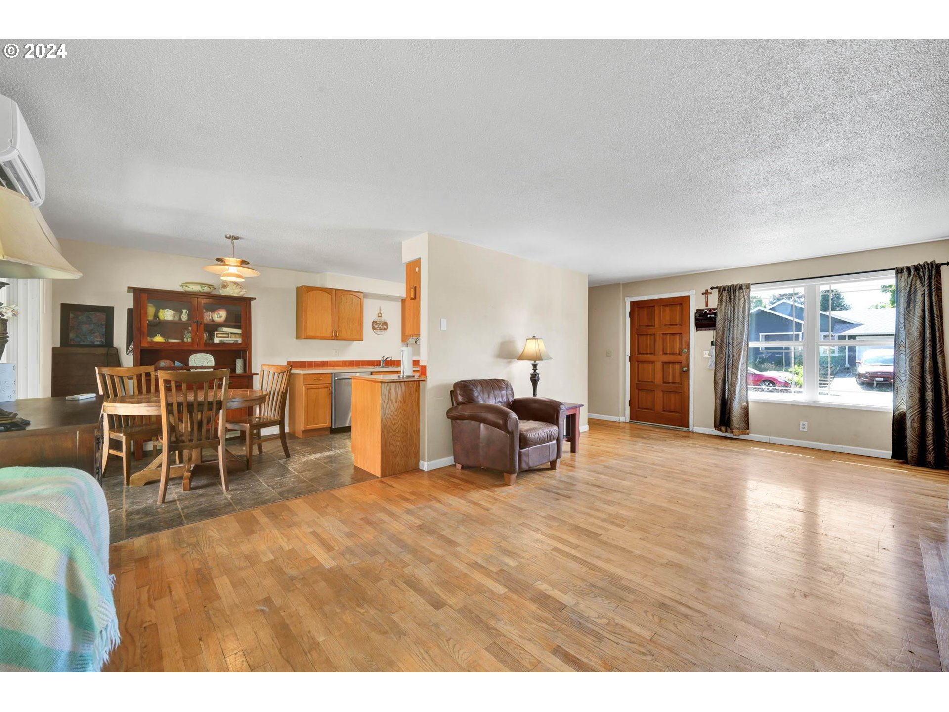 2301 Compton Street Eugene, OR 97404 - Photo 5 of 27 a living room with furniture large window and wooden floor