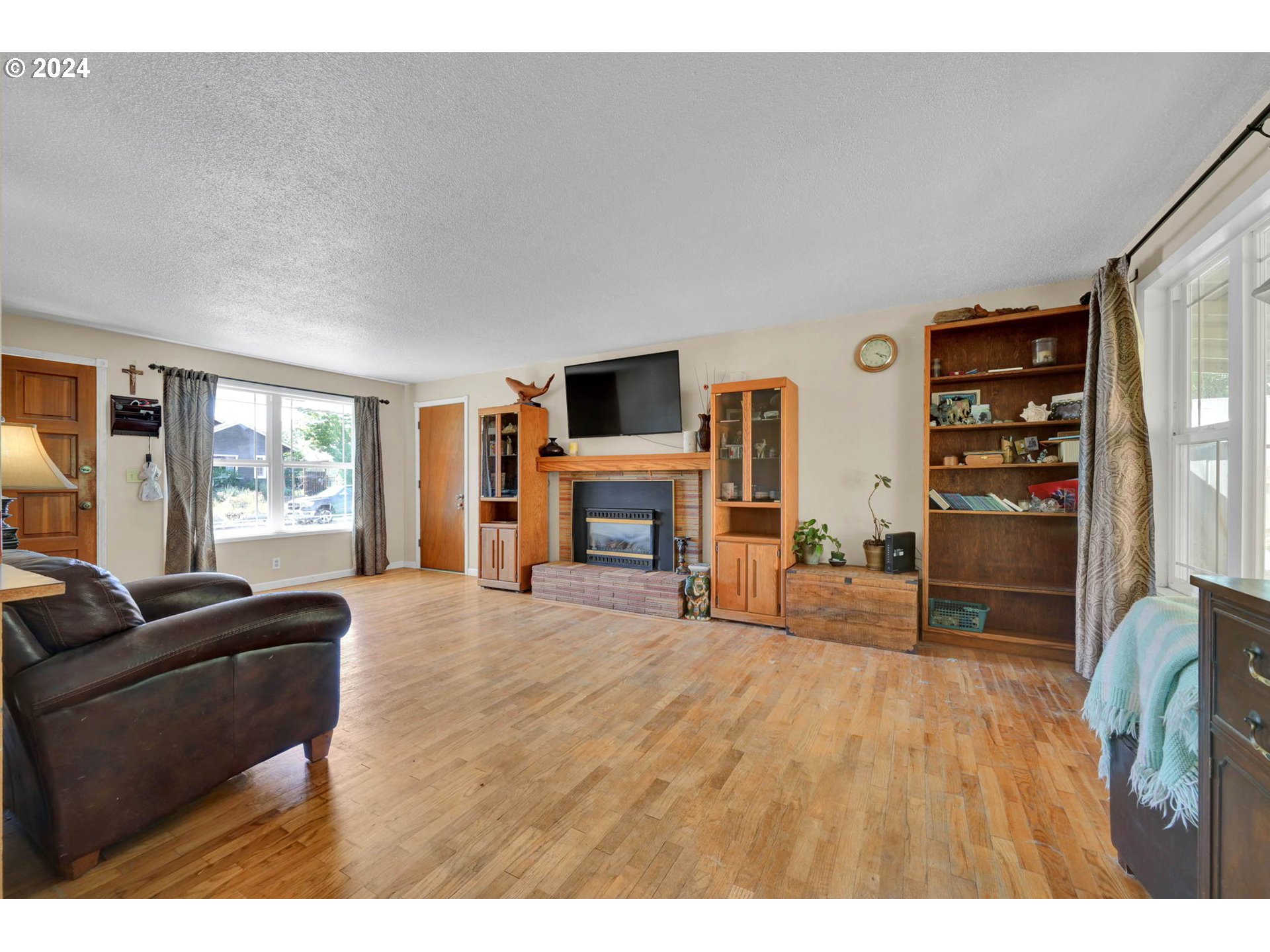 2301 Compton Street Eugene, OR 97404 - Photo 6 of 27 a living room with furniture and a fireplace