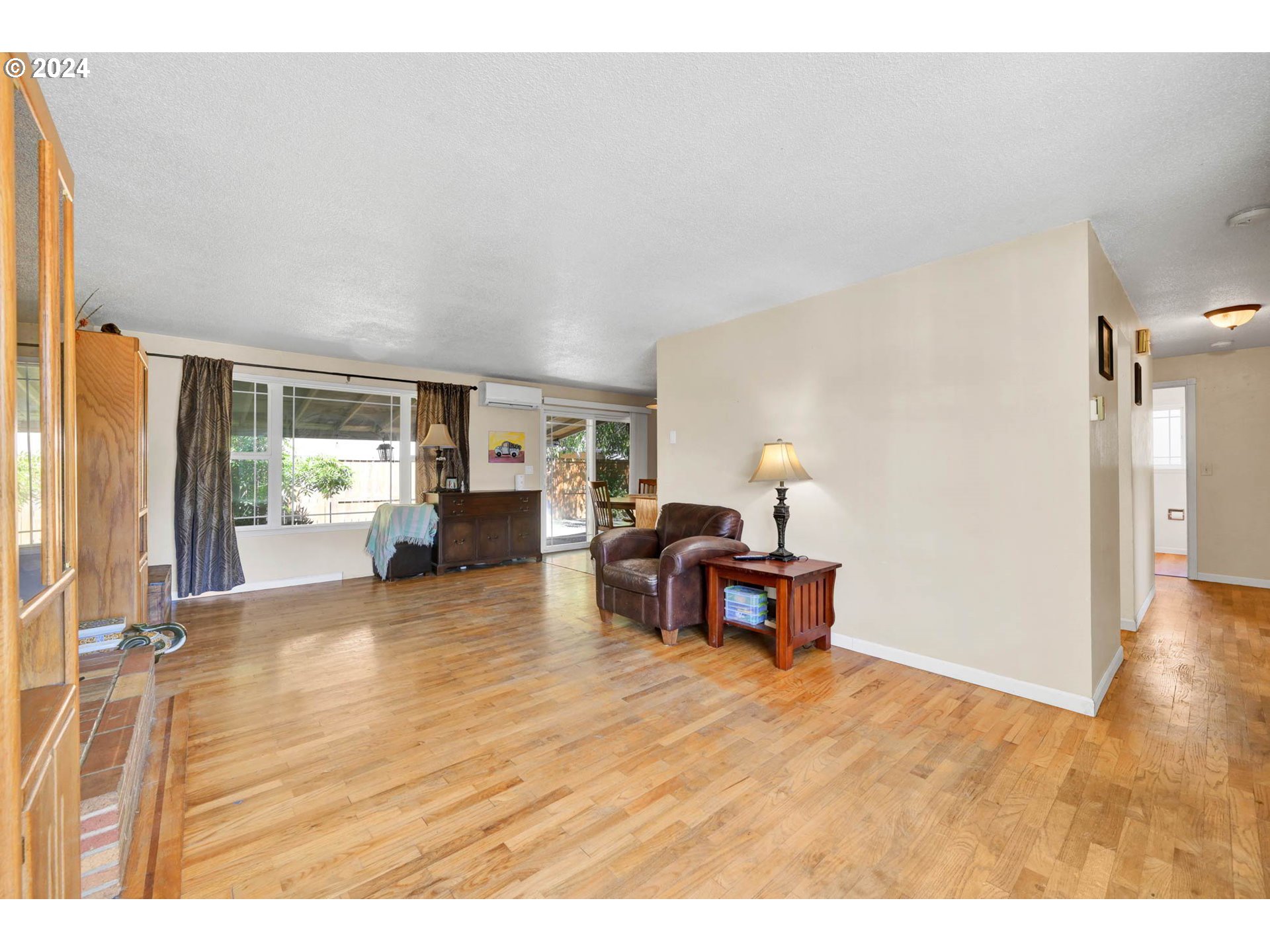 2301 Compton Street Eugene, OR 97404 - Photo 7 of 27 a living room with furniture and a wooden floor
