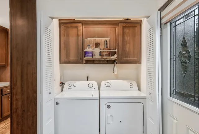 a utility room with dryer and washer