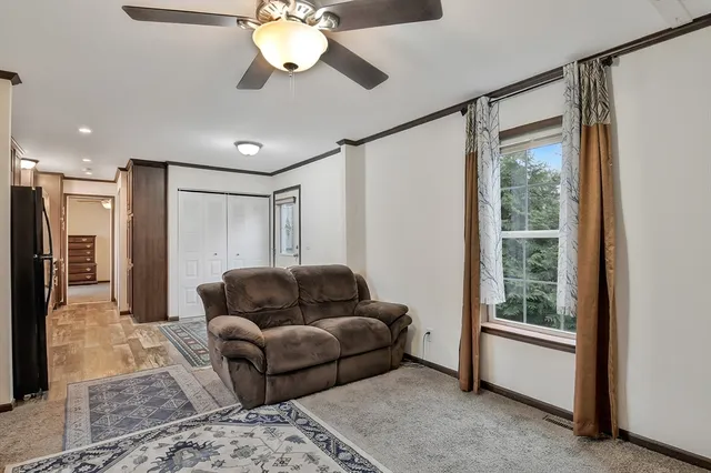 a living room with furniture and a window