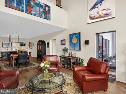 a living room with furniture fireplace and flat screen tv