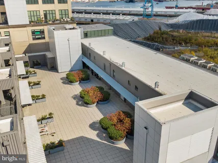 a kitchen with stainless steel appliances granite countertop a sink and a refrigerator