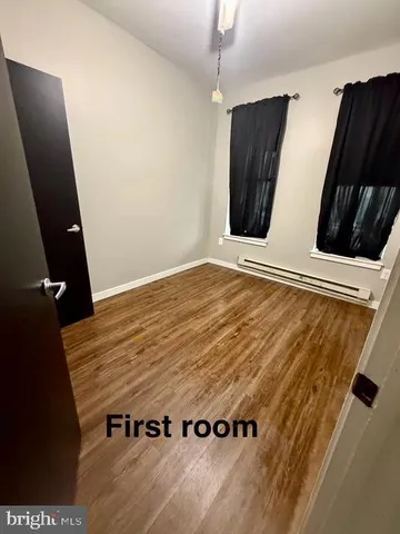 a view of kitchen with wooden floor