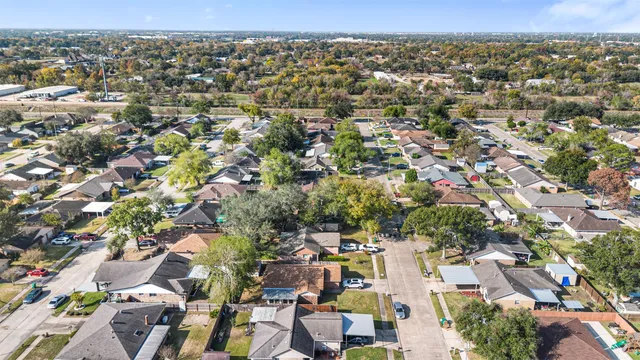 an aerial view of residential houses with outdoor space