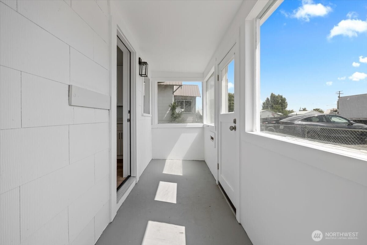 106 West Birch Avenue Ritzville, WA 99169 - Photo 2 of 17 a view of a hallway view with wooden floor and staircase