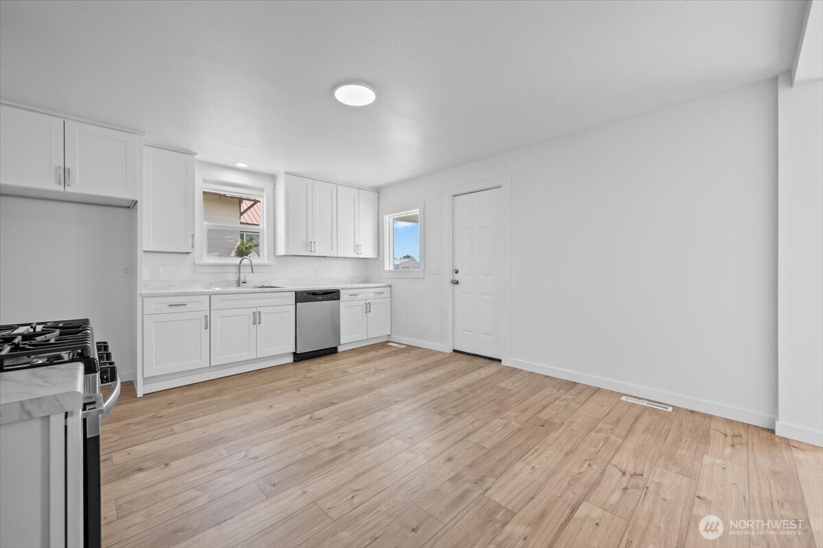 106 West Birch Avenue Ritzville, WA 99169 - Photo 4 of 17 a view of a kitchen with wooden floor