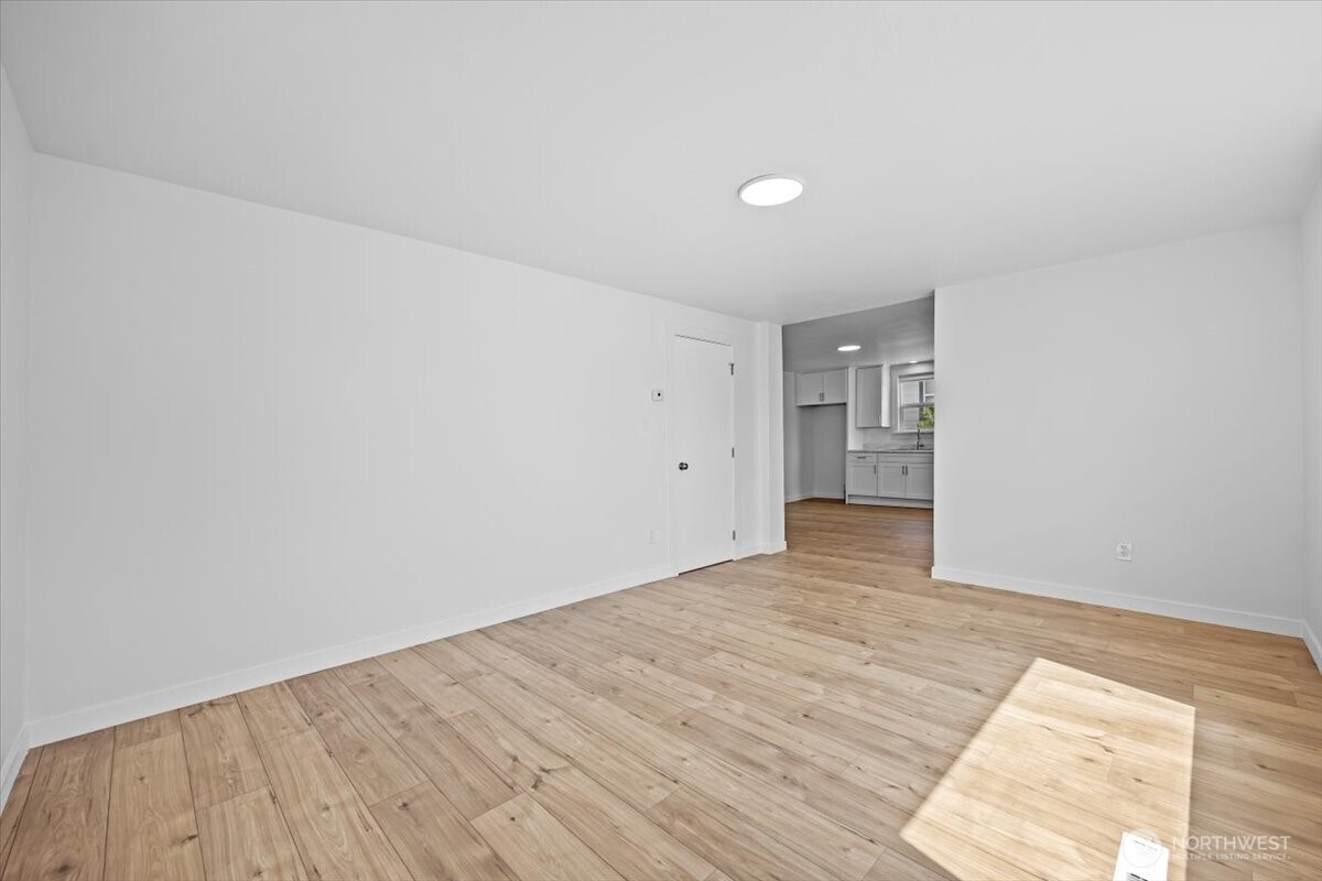 106 West Birch Avenue Ritzville, WA 99169 - Photo 7 of 17 a view of empty room with wooden floor