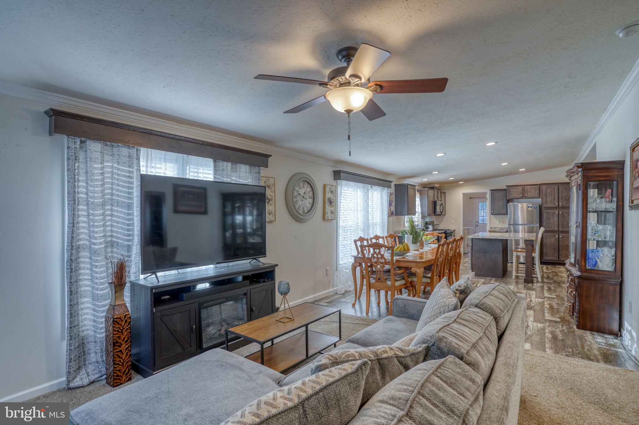 413 4th Street Frederica, DE 19946 - Photo 11 of 31 a living room with furniture and a flat screen tv