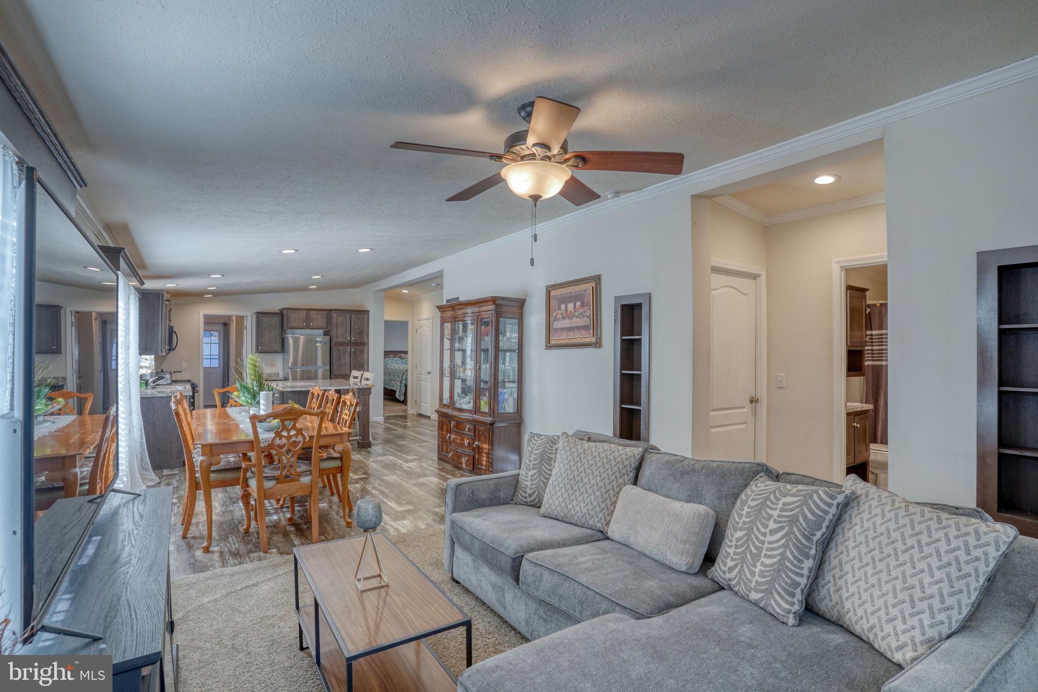 413 4th Street Frederica, DE 19946 - Photo 12 of 31 a living room with furniture and kitchen view