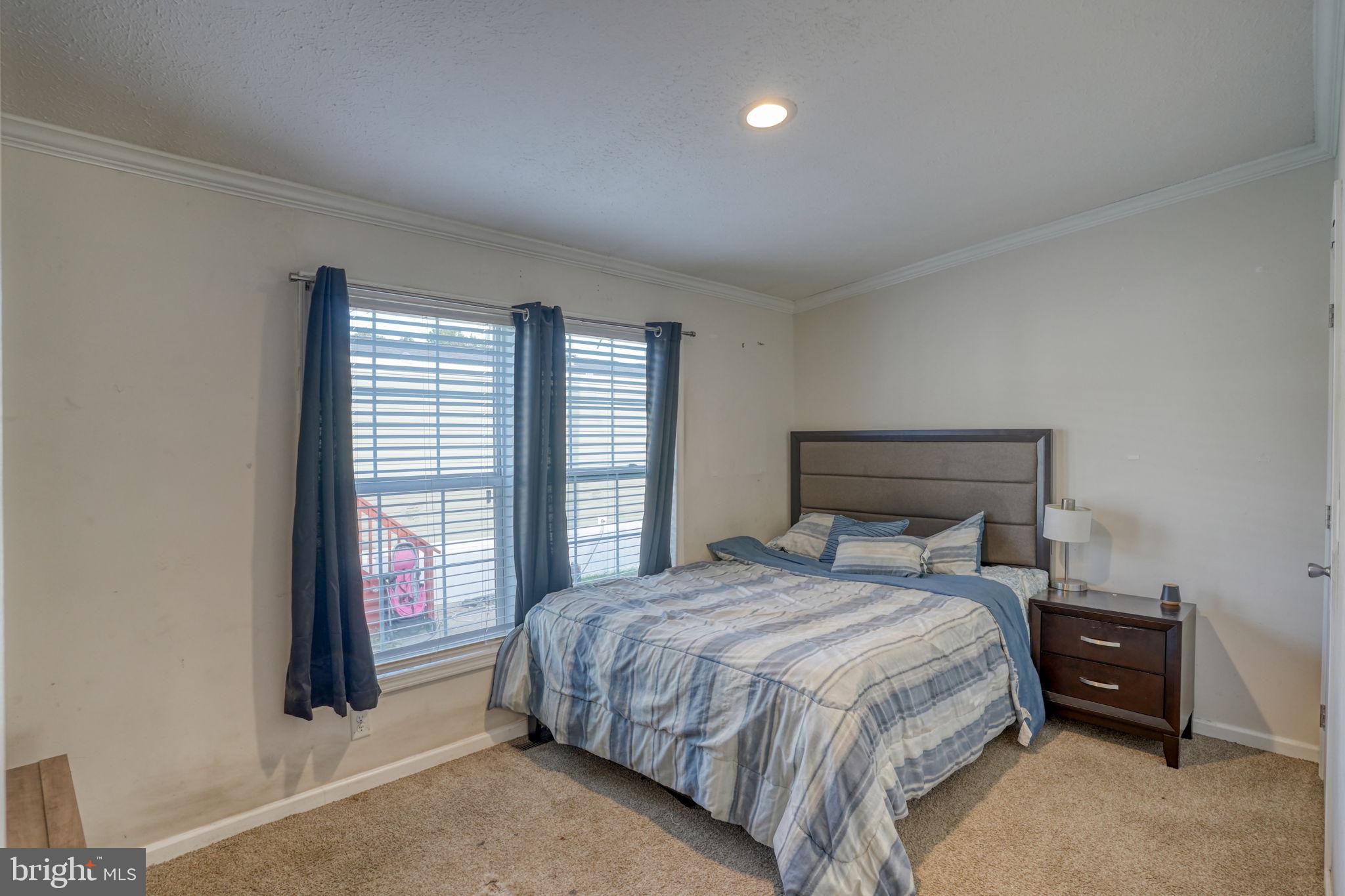 413 4th Street Frederica, DE 19946 - Photo 21 of 31 a bedroom with a bed and a window