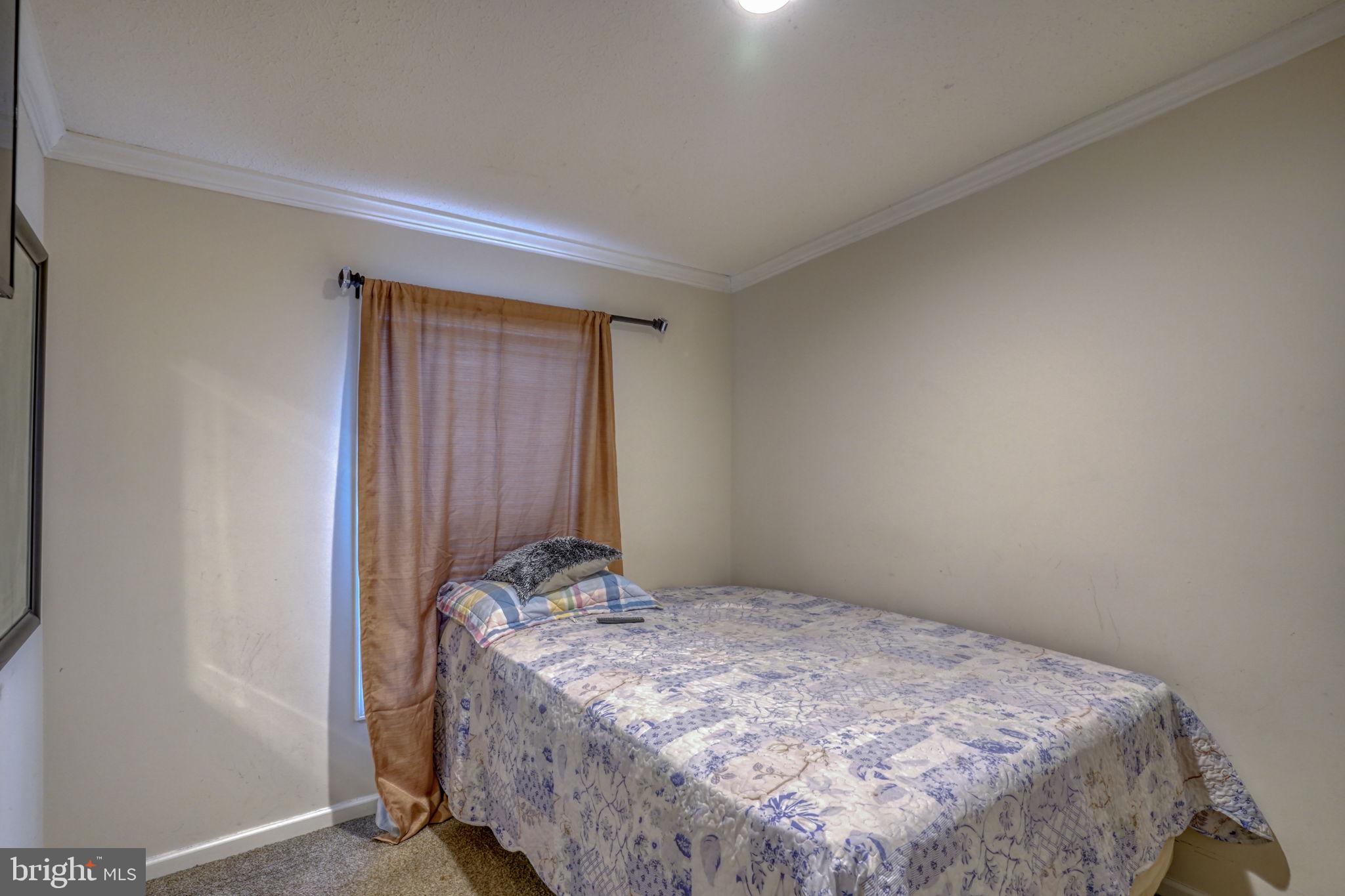 413 4th Street Frederica, DE 19946 - Photo 22 of 31 a bedroom with a bed and a closet