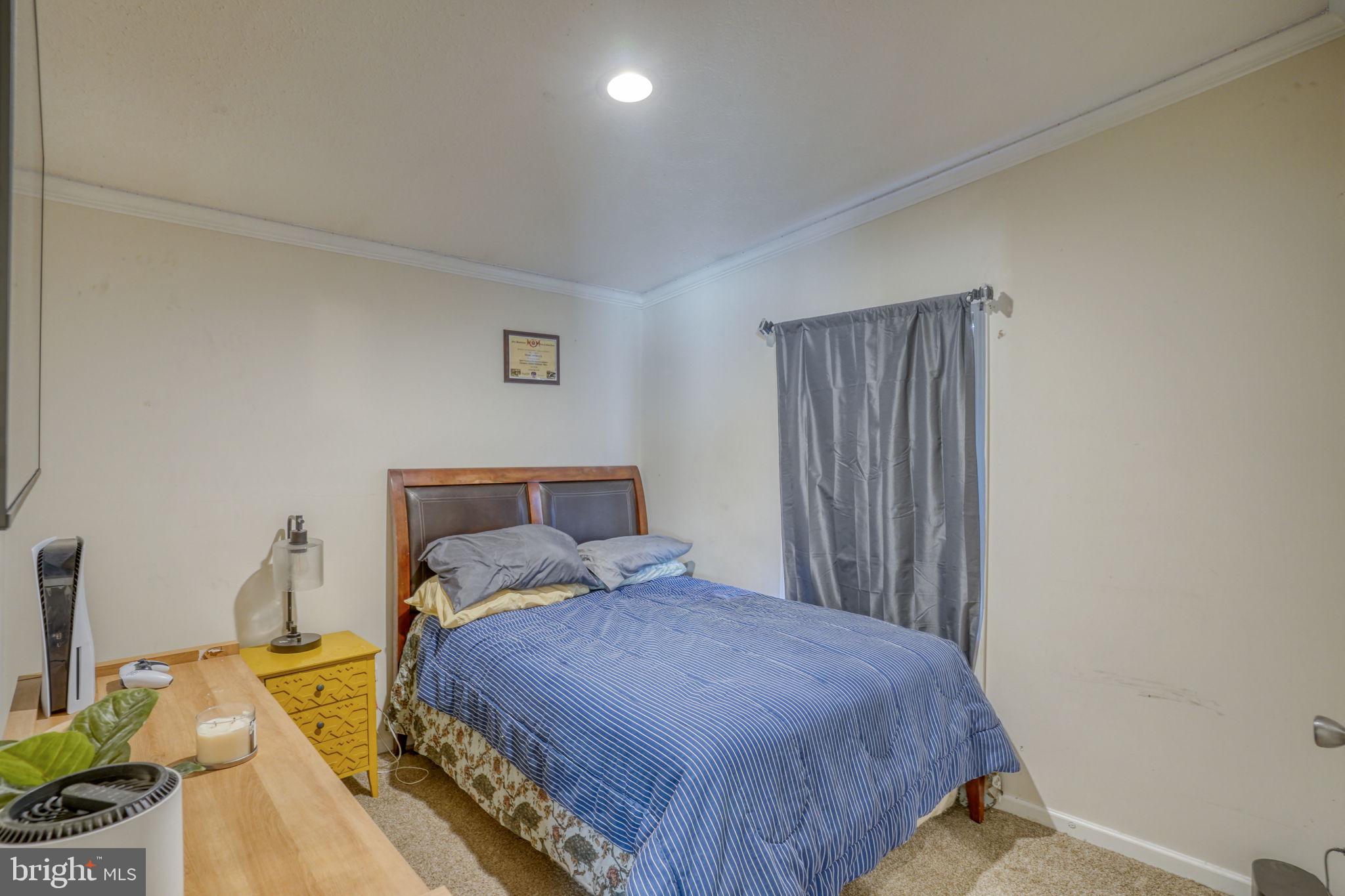 413 4th Street Frederica, DE 19946 - Photo 26 of 31 a bedroom with a bed and a window