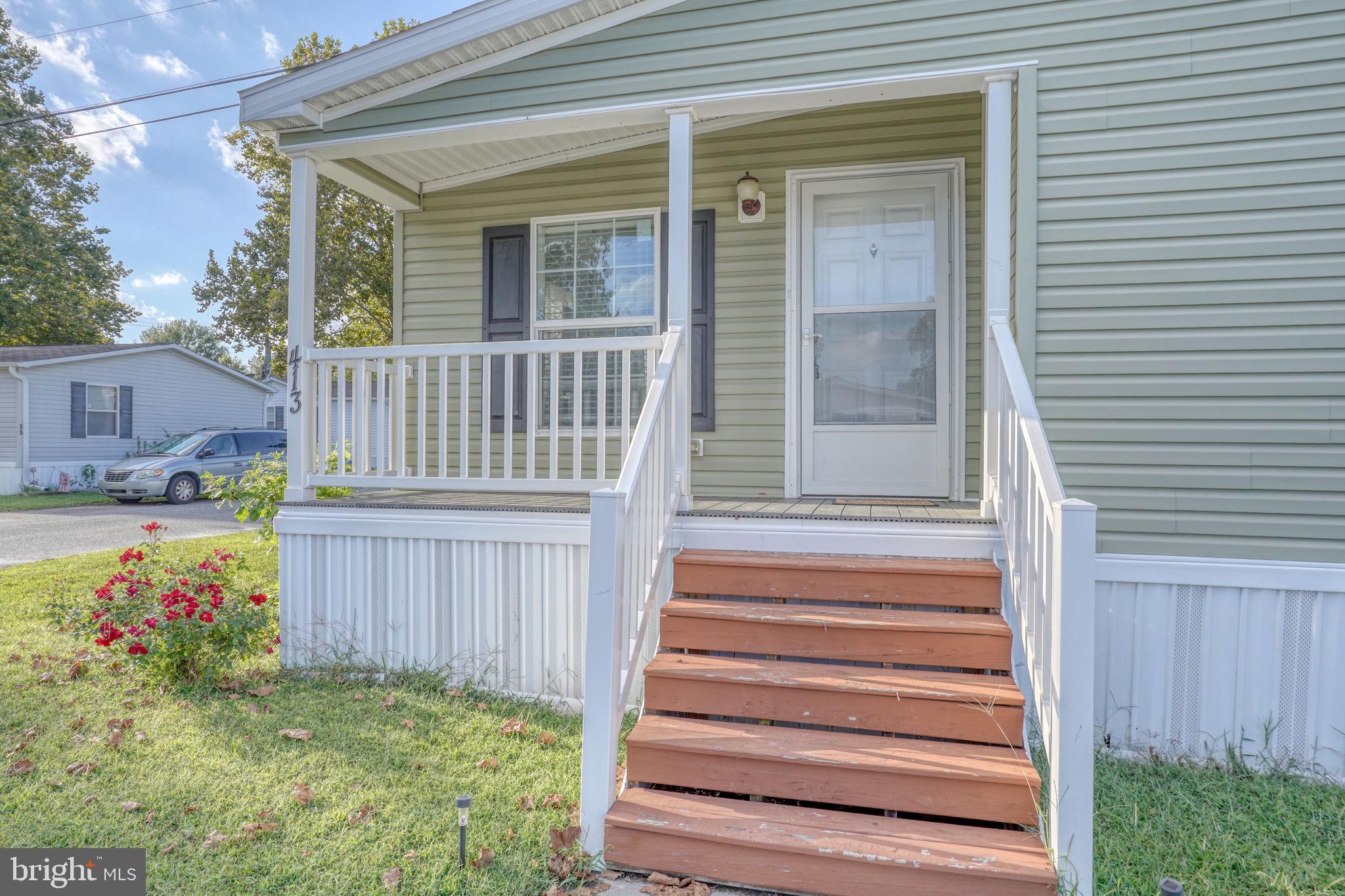 413 4th Street Frederica, DE 19946 - Photo 3 of 31 a view of a house with a small yard and wooden floor and fence