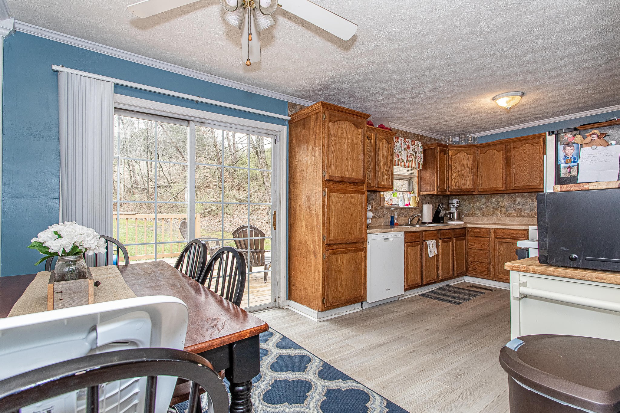 1101 Smith School Road Kodak, TN 37764 - Photo 10 of 23 a kitchen with sink refrigerator dining table and chairs