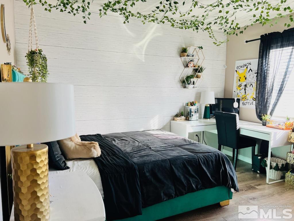 8908 Quail Falls Drive Reno, NV 89506 - Photo 12 of 17 a bedroom with a bed and a table in it