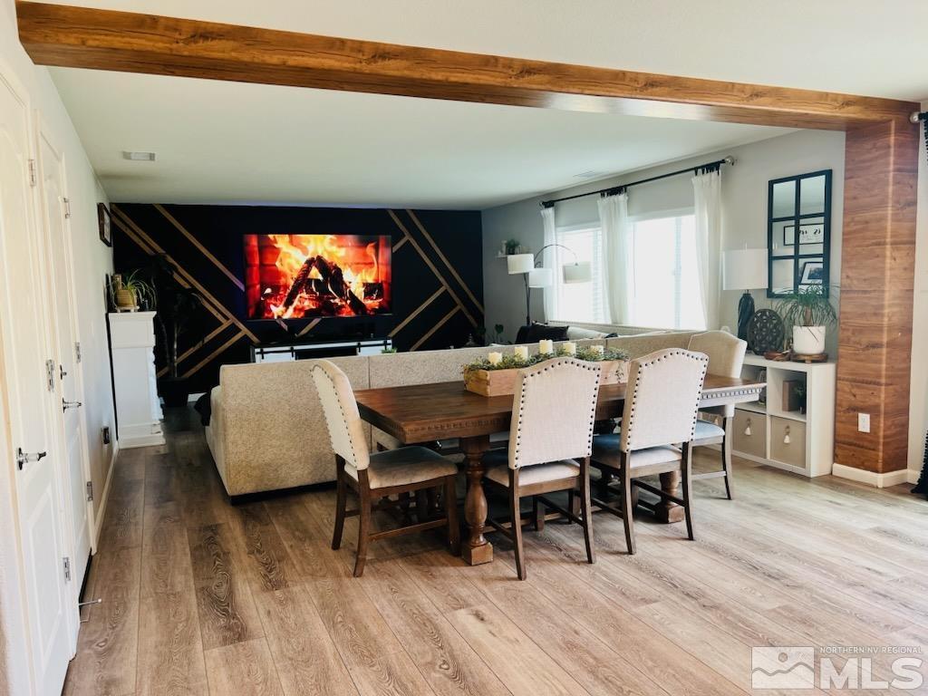 8908 Quail Falls Drive Reno, NV 89506 - Photo 4 of 17 a view of a dining room with furniture and wooden floor
