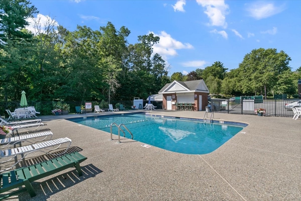 25 Clark's Road, Unit 101 Amesbury, MA 01913 - Photo 28 of 32 a view of a swimming pool with a patio
