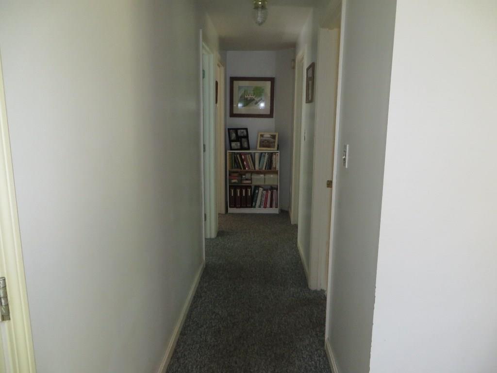 650 Townhouse Road East Waterboro, ME 04030 - Photo 7 of 19 Hallway from kitchen to bath and...