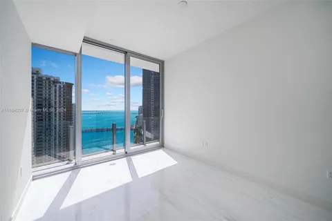a bathroom with a toilet sink and shower