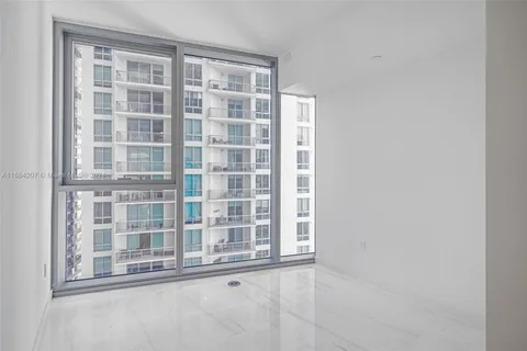 a bathroom with a shower sink and mirror