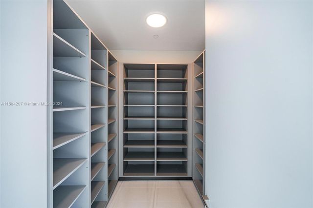 a view of an empty room with sliding glass door