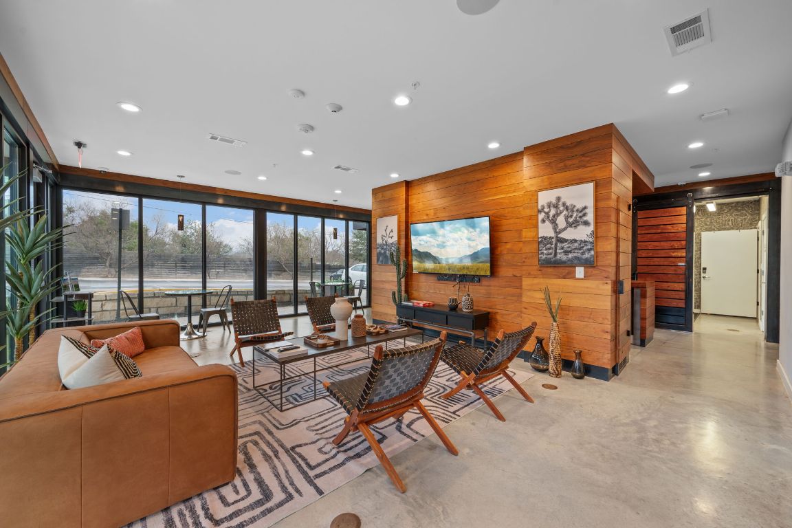 2505 Thornton Road, Unit 3103 Austin, TX 78704 - Photo 24 of 29 a living room with furniture and a flat screen tv