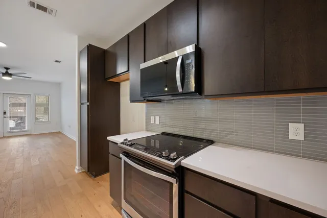 a kitchen with a stove and a microwave