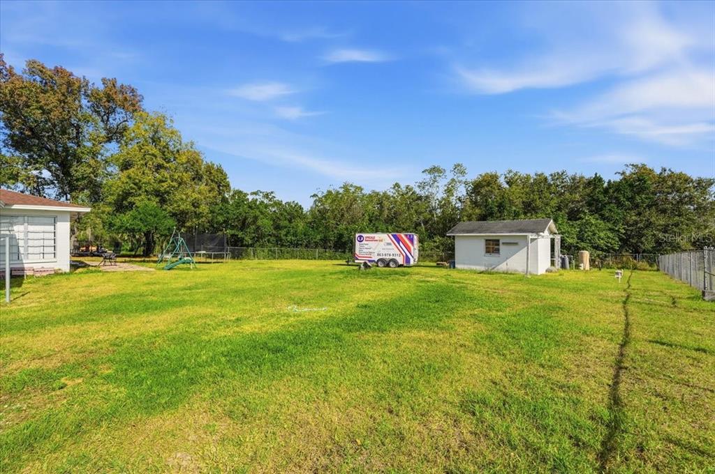 518 West Lake Wales Road North Lake Wales, FL 33859 - Photo 22 of 28 a front view of a house with garden