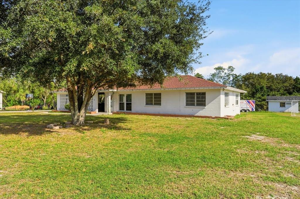 518 West Lake Wales Road North Lake Wales, FL 33859 - Photo 25 of 28 a front view of house with yard and green space
