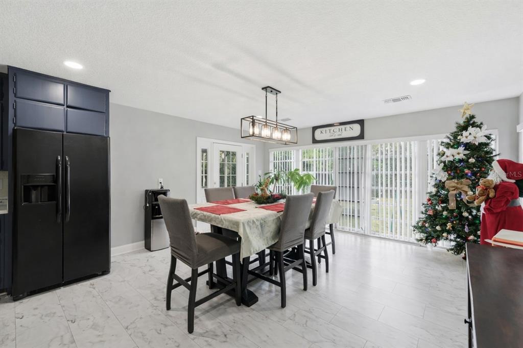518 West Lake Wales Road North Lake Wales, FL 33859 - Photo 7 of 28 a view of a dining room with furniture window and wooden floor